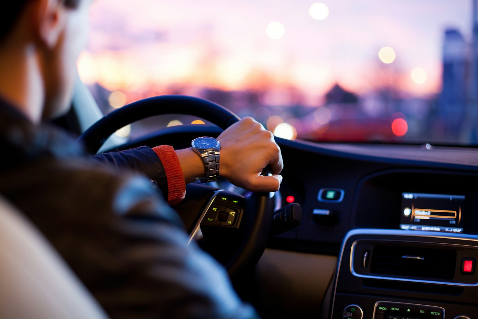 Driver at the wheel at dusk